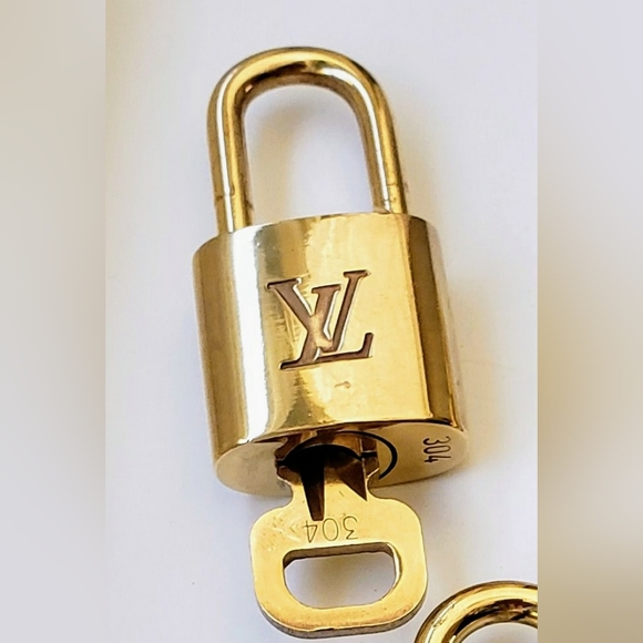 Louis Vuitton Accessories - Louis Vuitton pad lock, Vintage #304, gold tone brass. EUC.